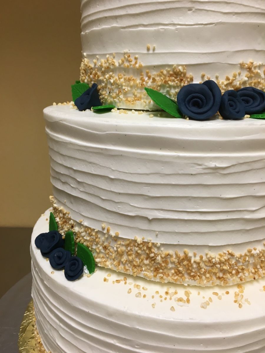 Wedding Cake with Navy Blue Flowers at Nichole's Fine Pastry, Fargo, ND